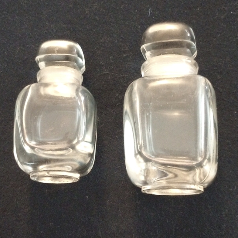 Givenchy parfum bottles. 2 Empty vintage bottles.